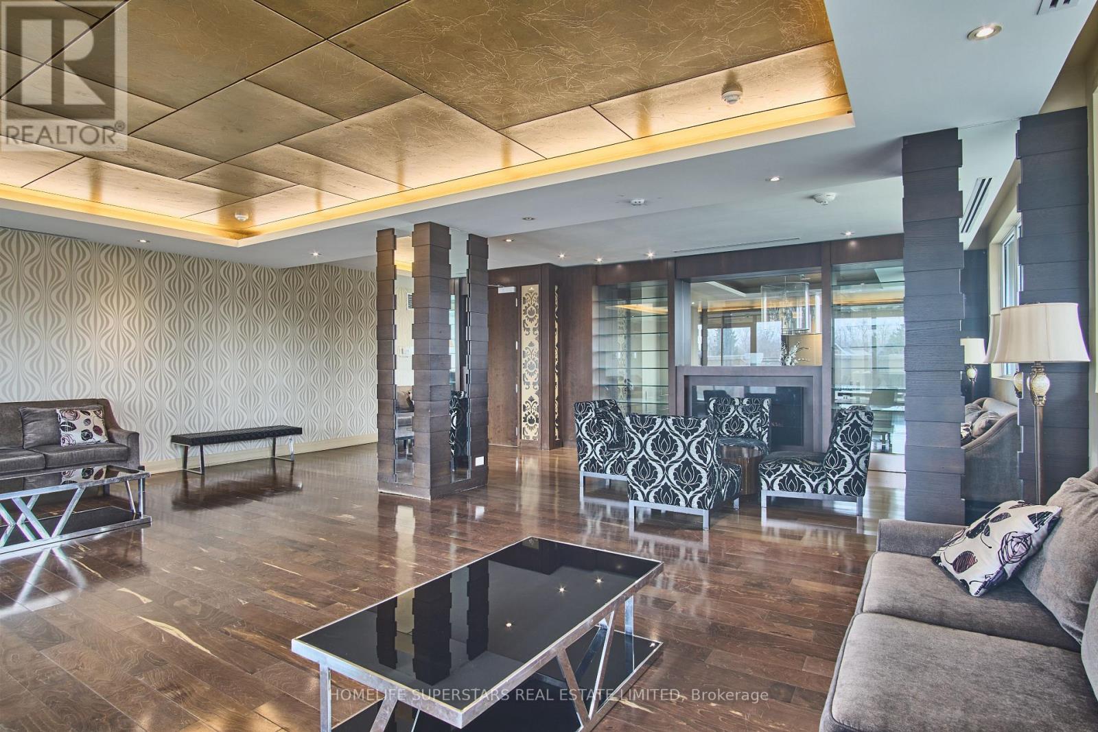 A living room with a black and white coffee table in the center.
