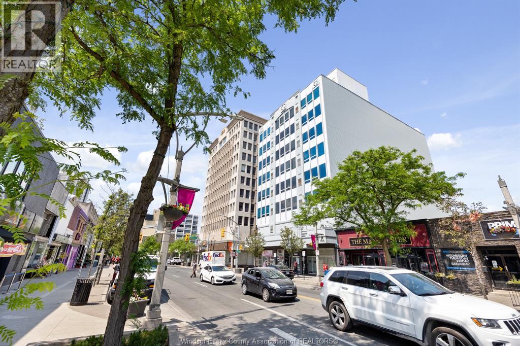 A street view with cars and buildings.