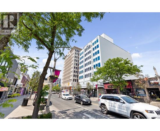 A street view with cars and buildings.