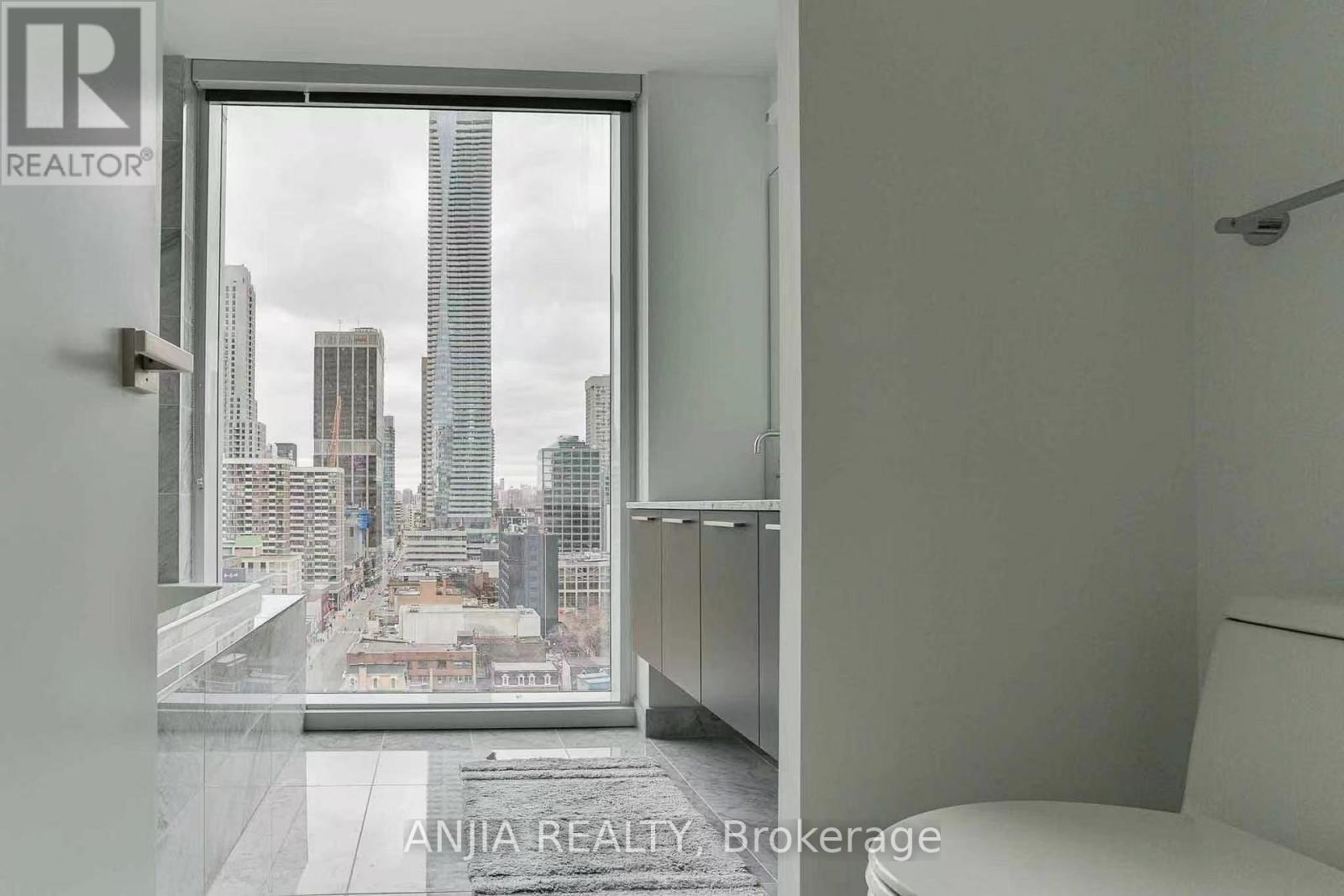 A realtor brokerage office with a view of the city.