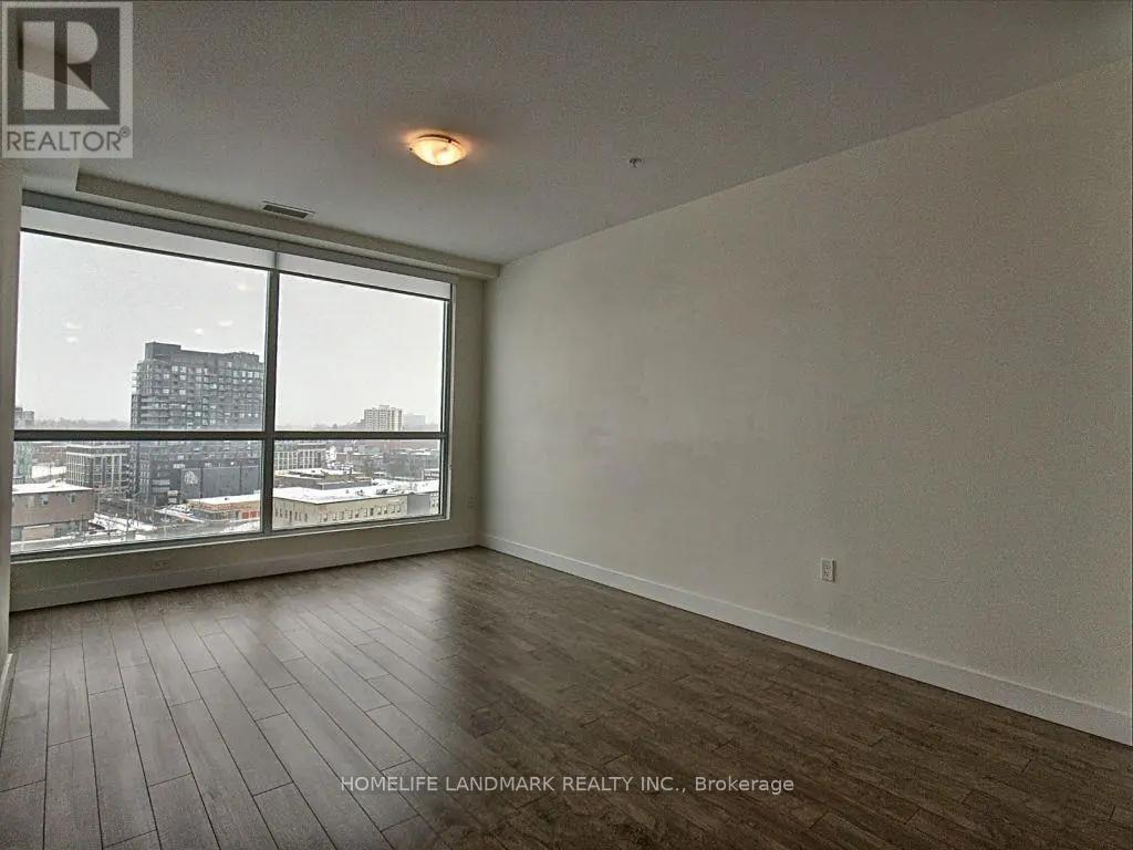 A room with a view of the city through the windows.