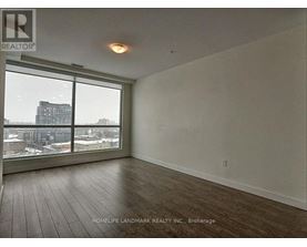 A room with a view of the city through the windows.