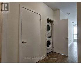 A laundry room with a washer and dryer built into the wall.