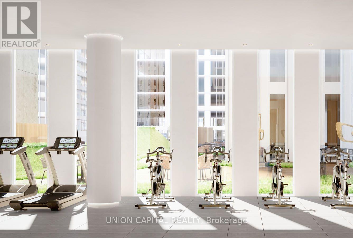 A gym with treadmills and exercise bikes is shown.