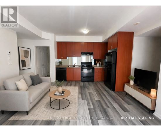 A modern living room with a grey sofa and a coffee table in the center.