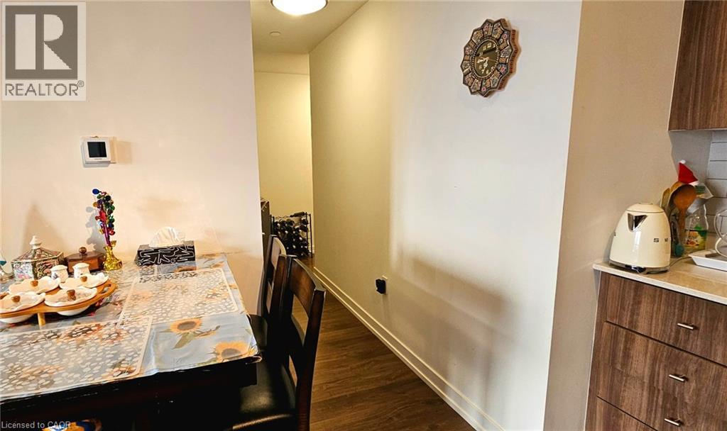 A dining room with a table set for a meal.