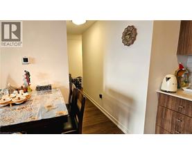 A dining room with a table set for a meal.