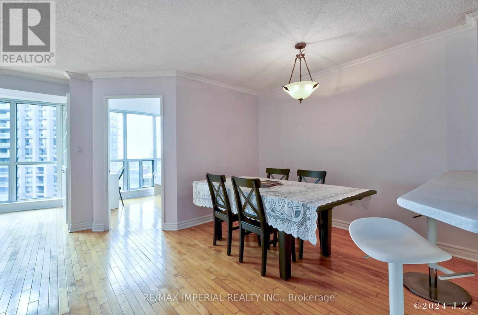 A dining room with a table set for four.