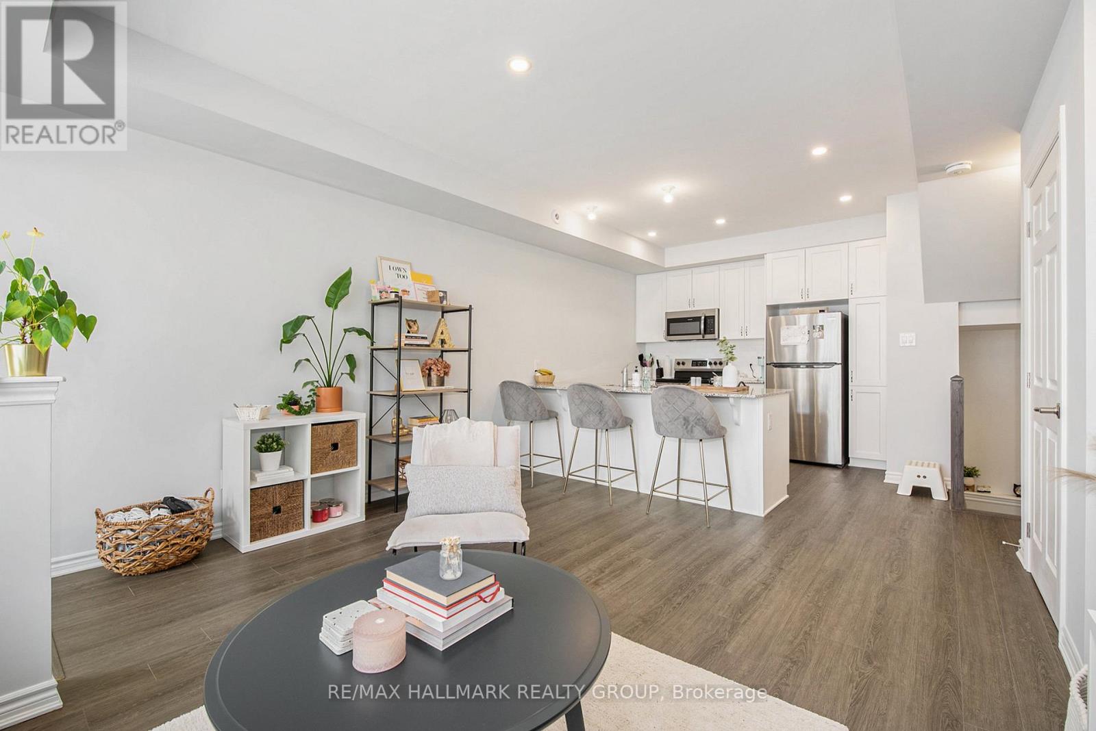 A modern living room with a grey coffee table and a grey sofa.