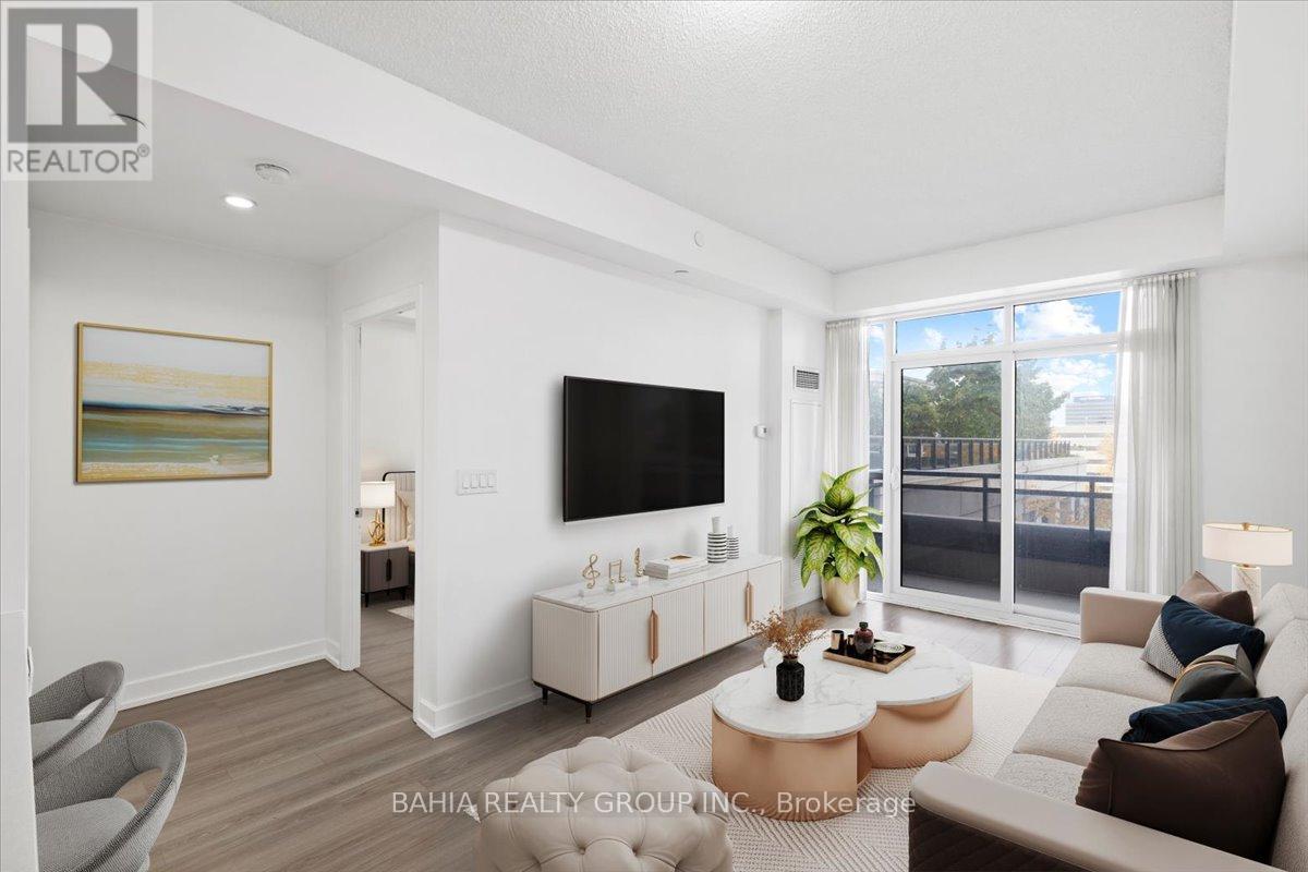A living room with a flat screen TV mounted on the wall.
