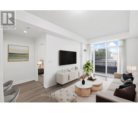 A living room with a flat screen TV mounted on the wall.