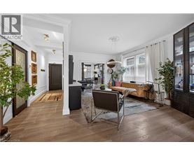 A well-lit, modern kitchen with a dining table and chairs.