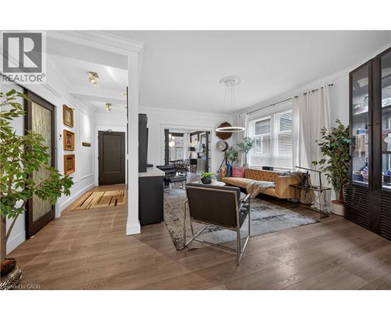 A well-lit, modern kitchen with a dining table and chairs.
