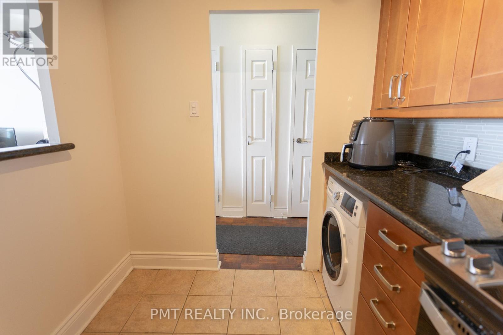 A laundry room with a washer and dryer.