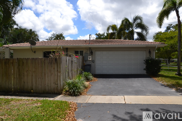A house with a garage and a driveway is for sale.