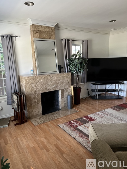 A living room with a fireplace and a couch.