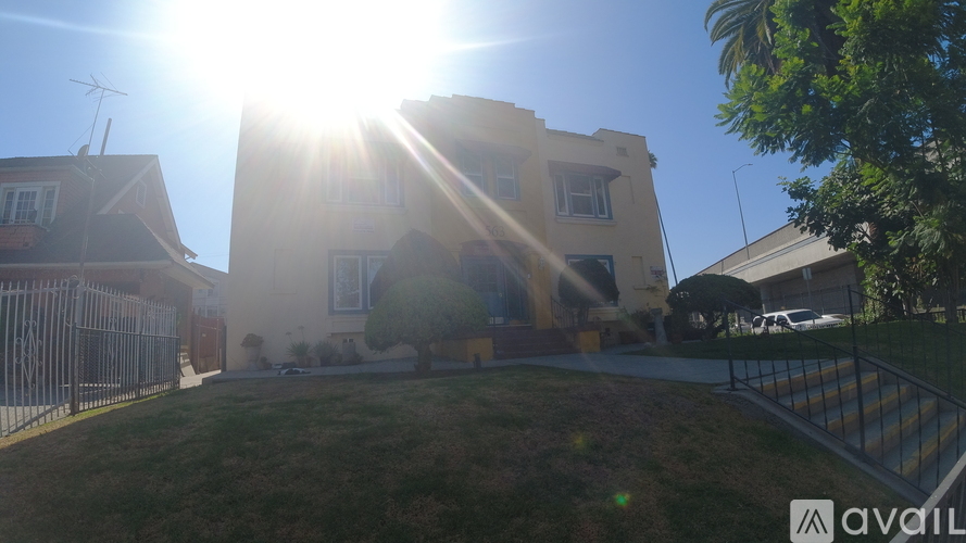 The sun is shining brightly over a residential area.