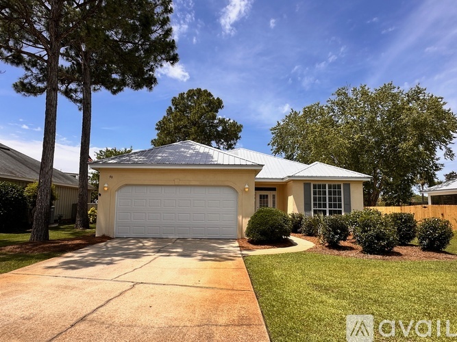 A house with a white garage door and a driveway.