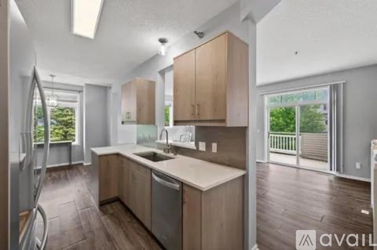 A kitchen with wooden cabinets and a white countertop.