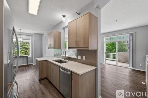A kitchen with wooden cabinets and a white countertop.