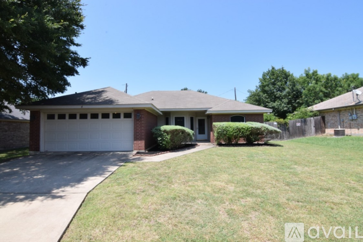 A house with a garage and a driveway.
