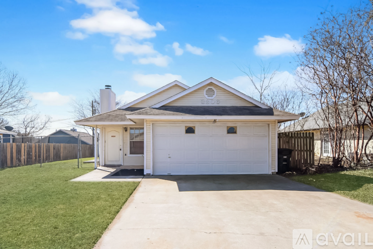 A two-car garage is attached to a house.