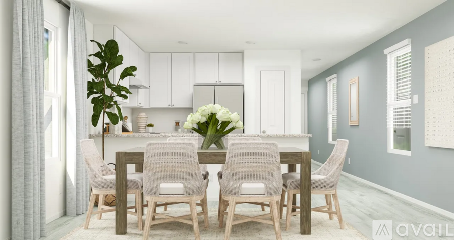 A dining room with a table set for four.