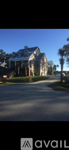 A house with a tree in front of it.