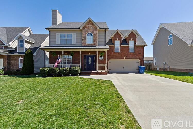 A house with a flag on the front porch is for sale.
