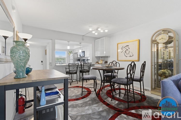 A dining room with a table set for six and a fire extinguisher on the side.