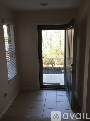 A room with a door leading outside.