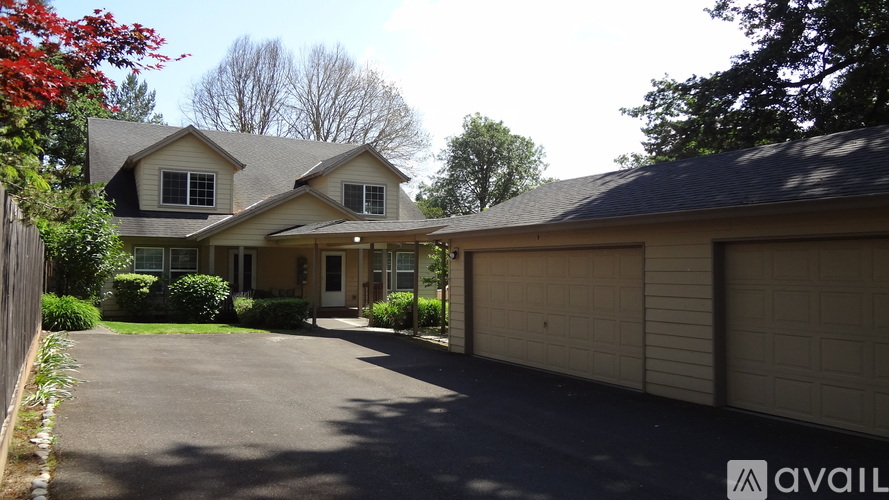 A house with a driveway in front of it.