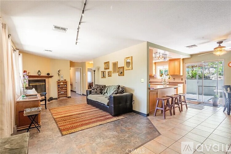 A living room with a couch, a chair, and a table.