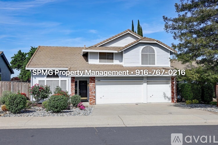 A house with the text "SPMG Property Management - 916-767-0216" on the front yard.