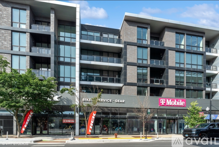 A modern building with a T-Mobile store in front.
