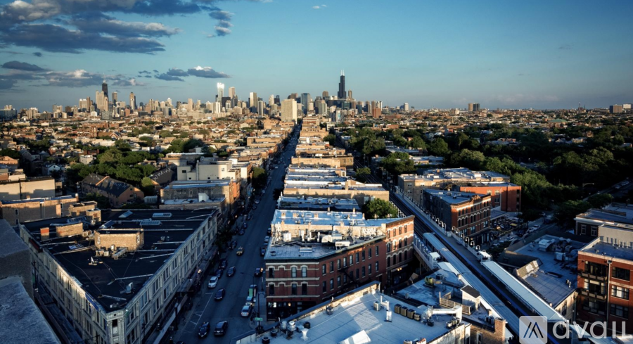 A cityscape with a clear sky and buildings of various heights.