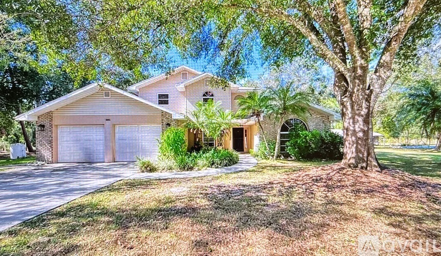 A house with a tree in front of it.