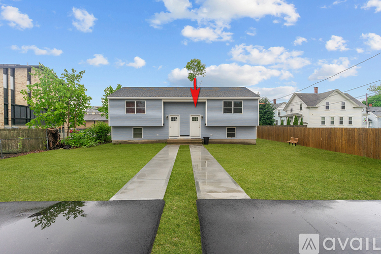 A house with a red arrow pointing to the roof.