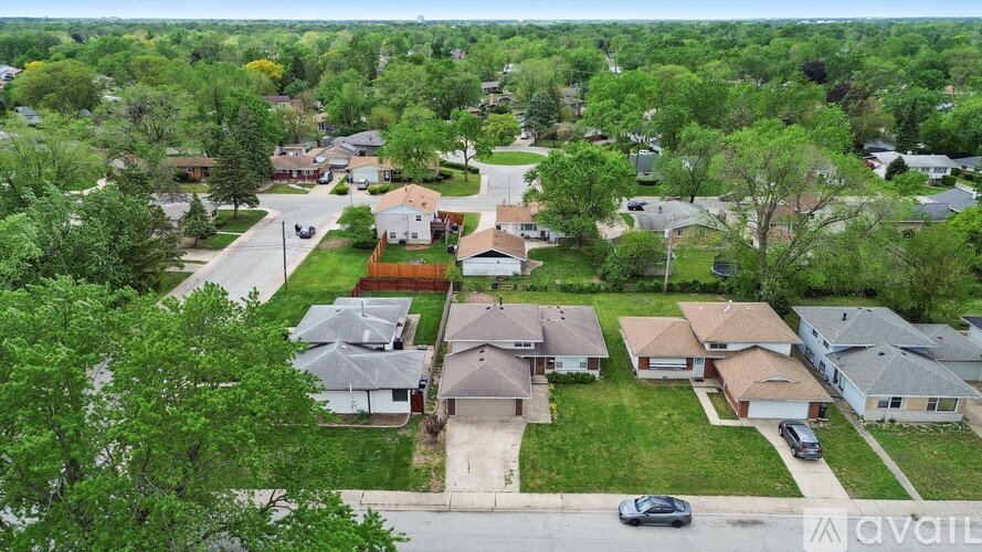 A suburban neighborhood with houses and trees.