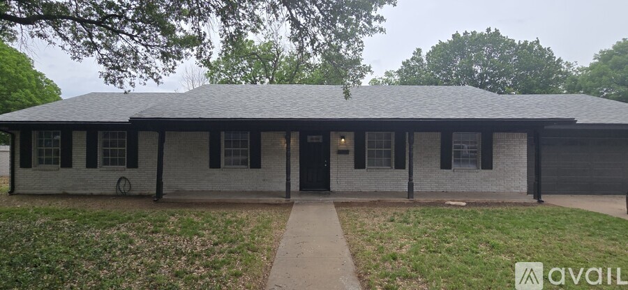 A small house with a porch and a front door.