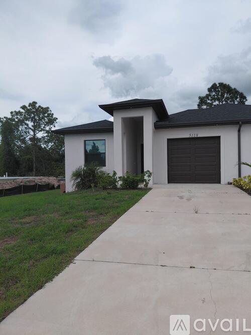 A house with a driveway in front of it.
