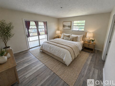 A room with wooden flooring and a bicycle is available.
