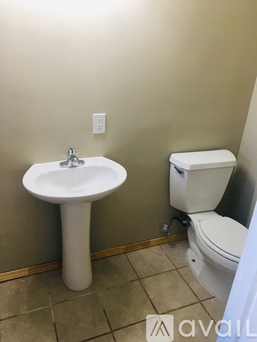 A bathroom with a sink and toilet.