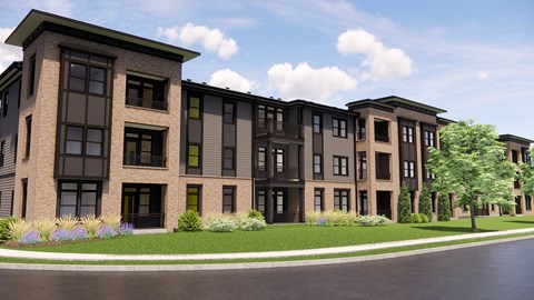A modern apartment building with a green lawn in front.