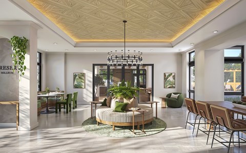 A modern living room with a large circular sofa and a chandelier.