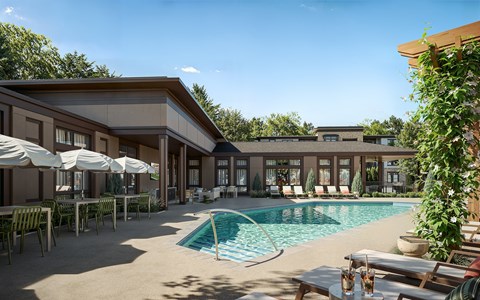 A pool area with a building in the background.