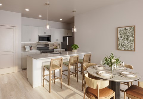 A modern kitchen with a dining table set for four.