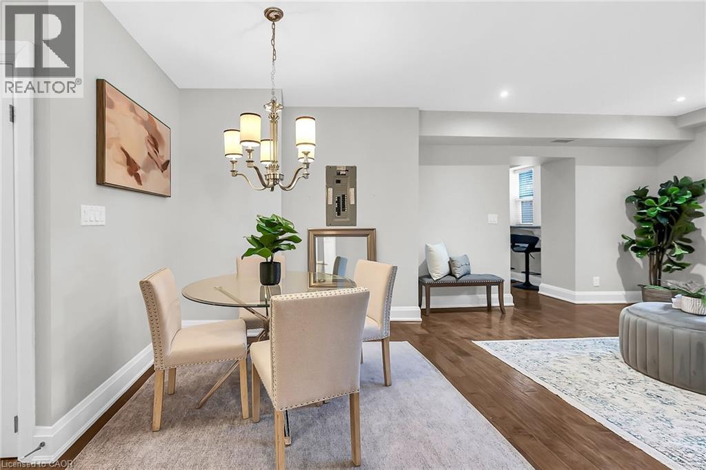 A dining room with a table set for four.