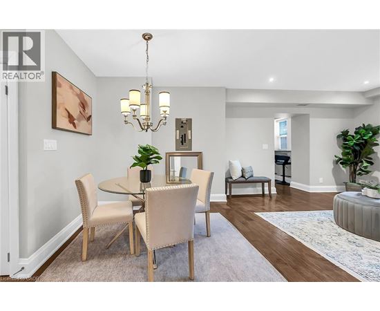 A dining room with a table set for four.