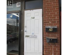A white door with a sign that says 24A.